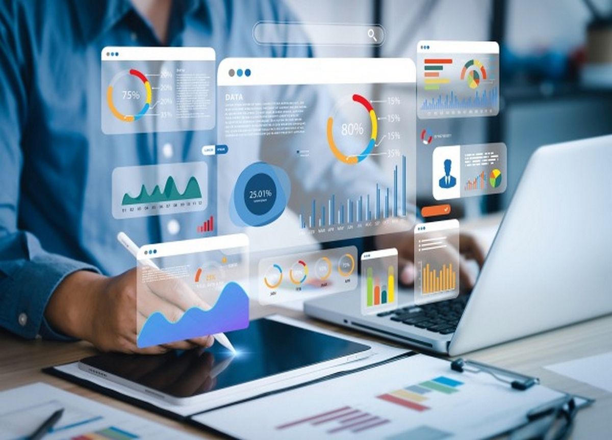 Italian business leader reviewing a financial dashboard on a laptop